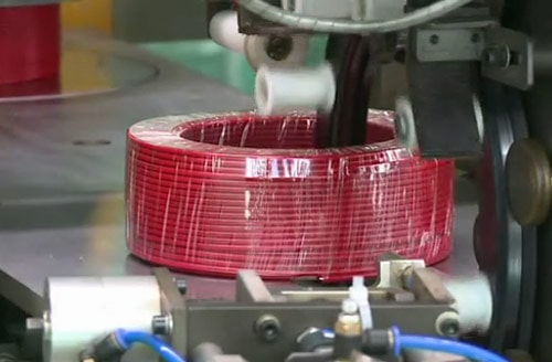 Automatic cable coiling and wrapping machine